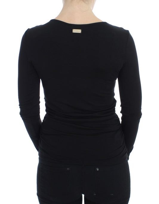 Black long sleeve shirt with a high neckline and visible seams