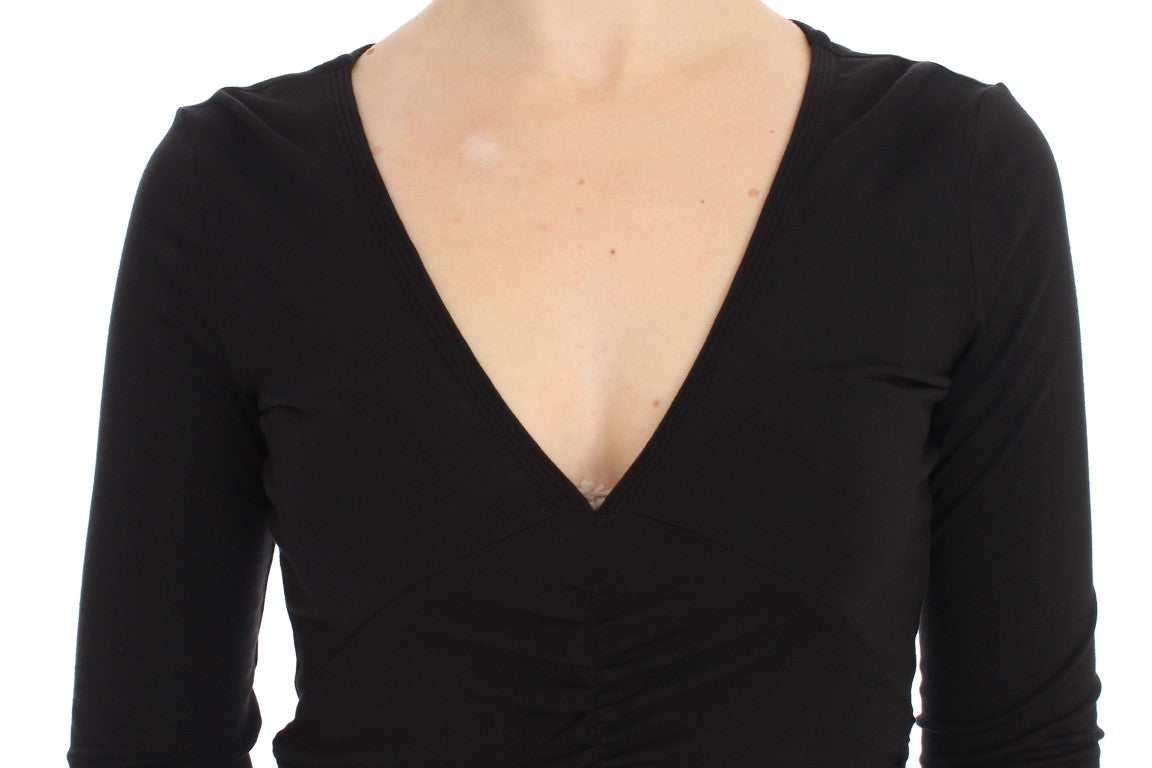 Black long sleeve top with V neckline and ruched detailing