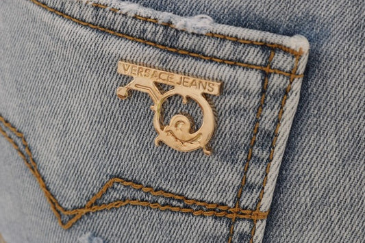 Small gold logo on blue jeans