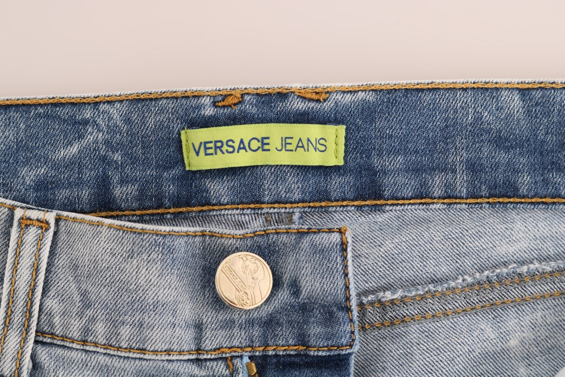 Blue denim jeans with a coin button