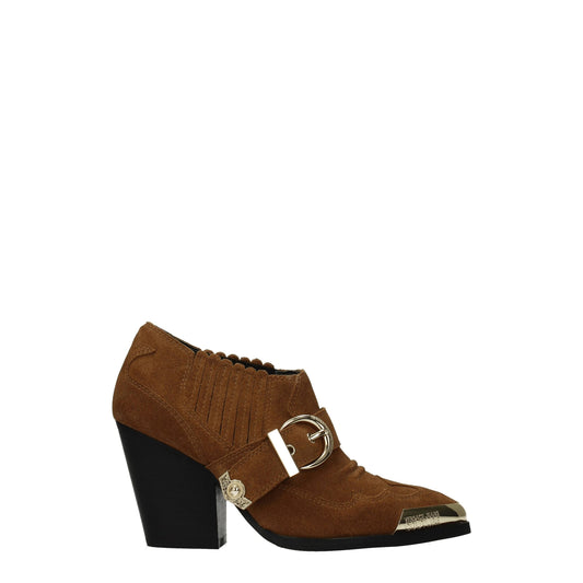Brown suede ankle boot with heel and buckle detail