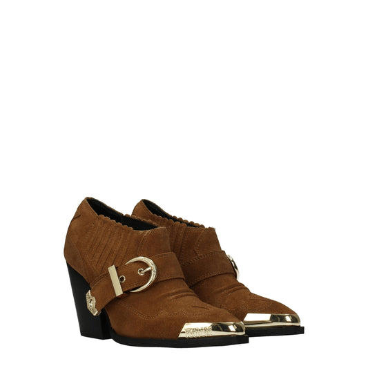 Brown suede ankle boot with gold buckle detailing