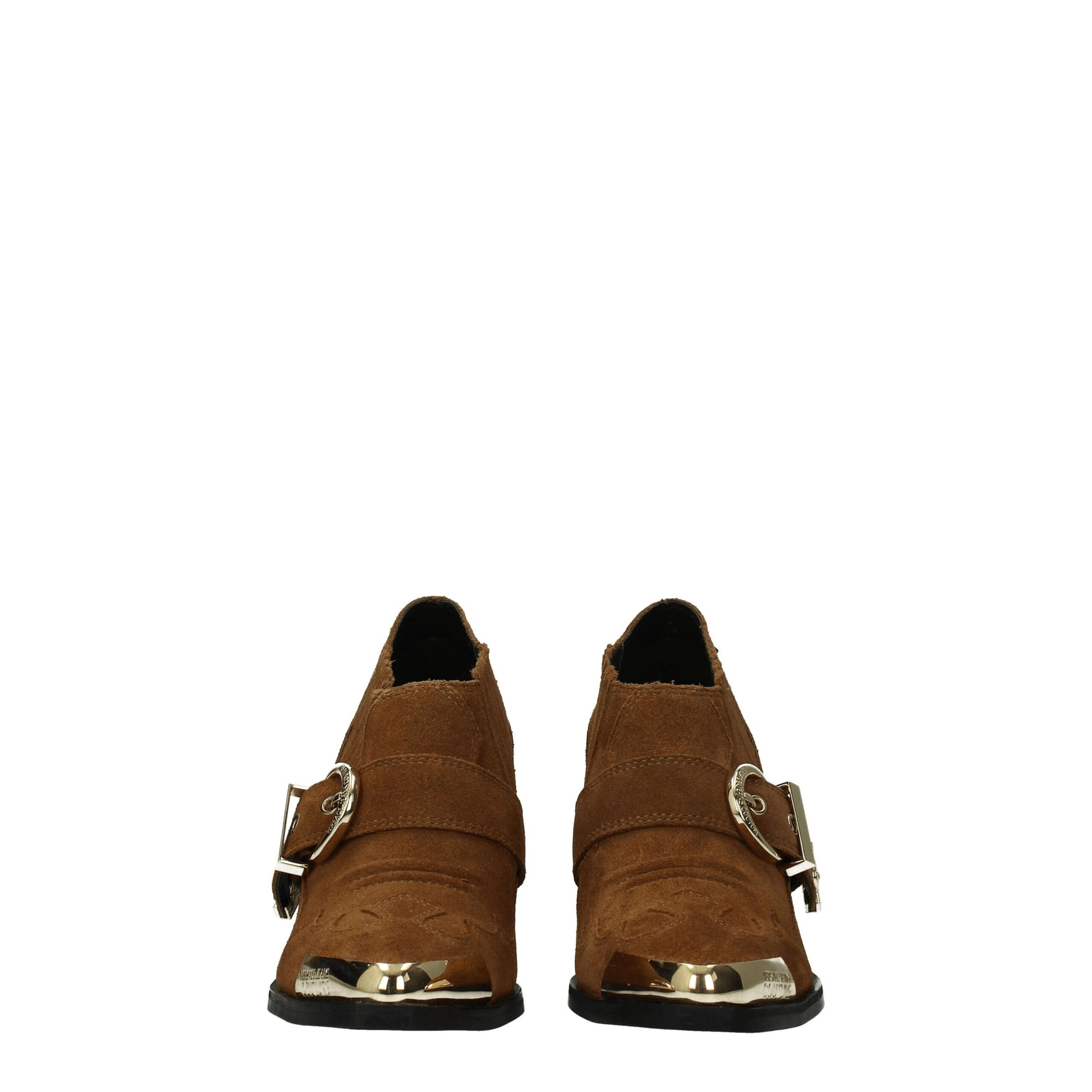 Pair of brown boots with gold buckles