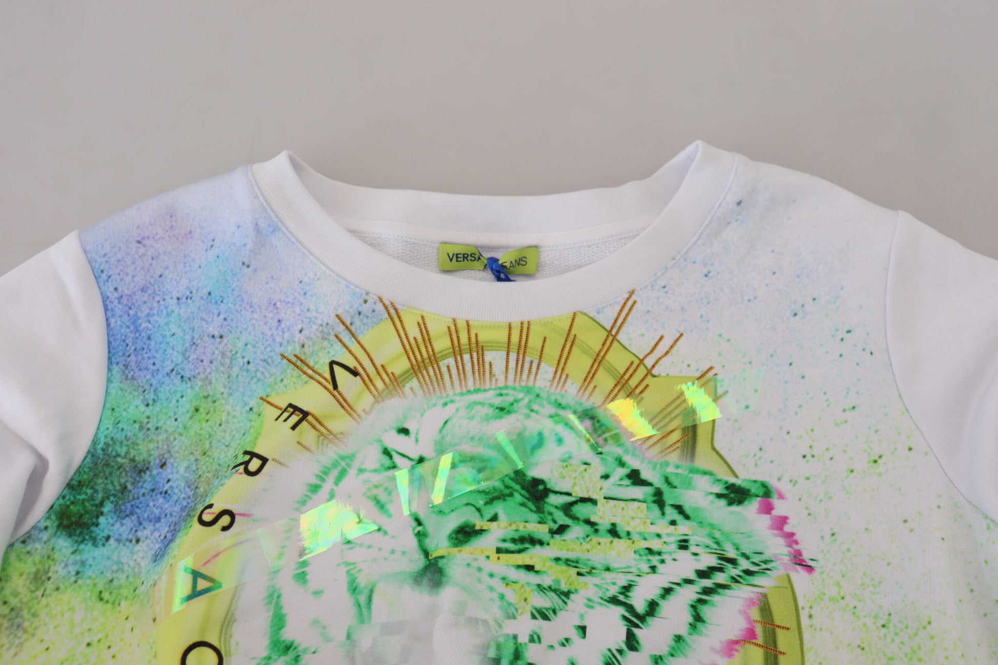White long sleeve shirt with colorful design on front