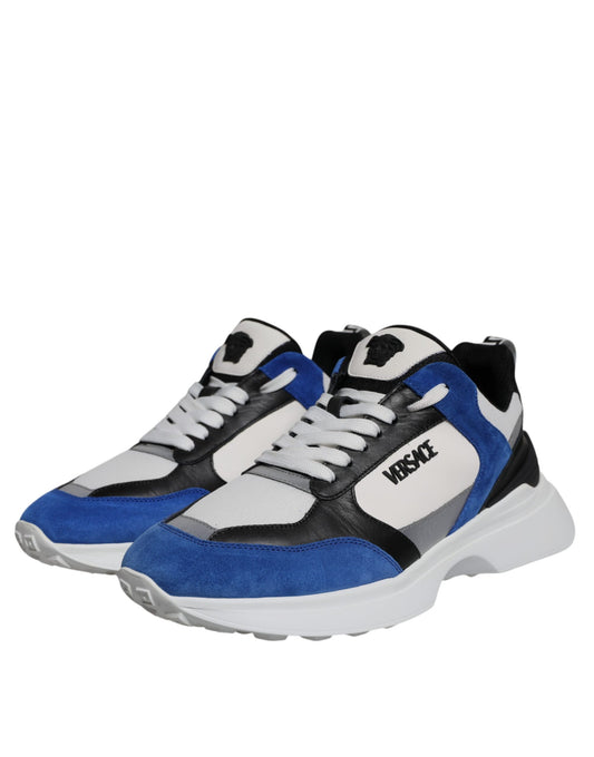 Pair of blue and white sneakers with black laces