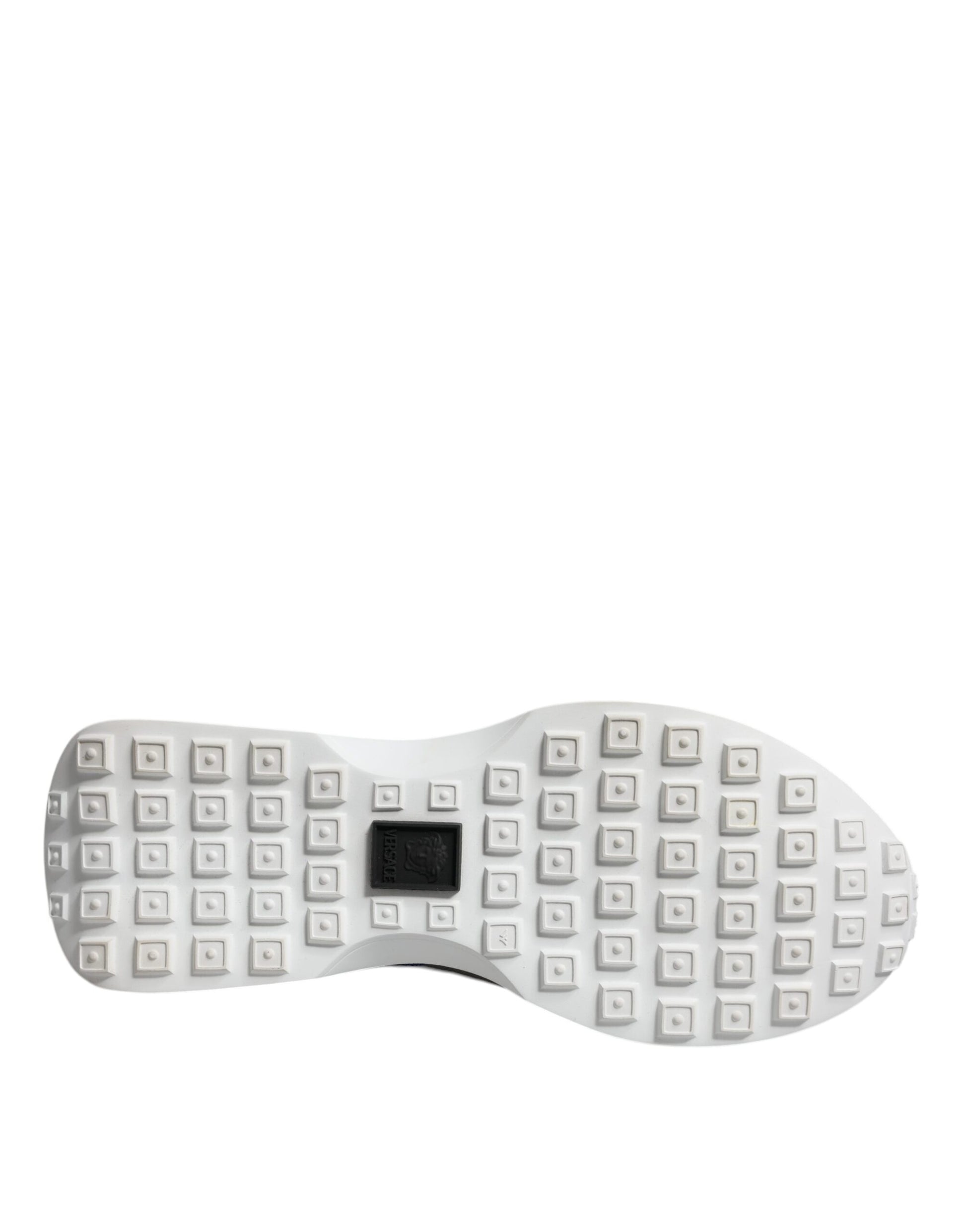 White shoe with a pattern of small white squares on the sole