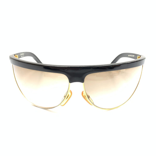 Pair of sunglasses with black frame and gold accents