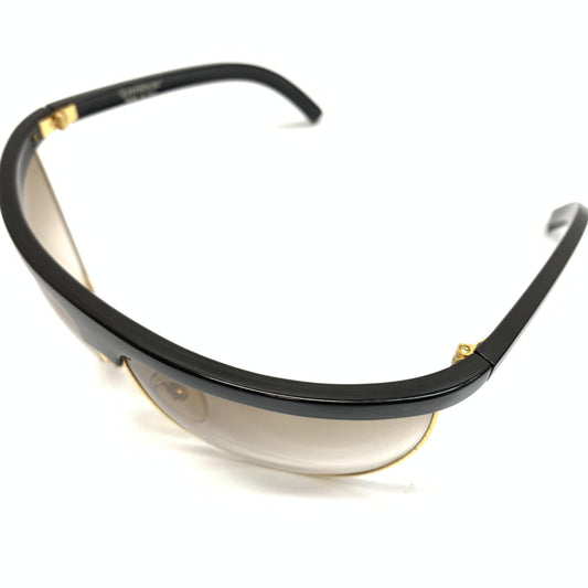 Sunglasses with black frame and gold accents