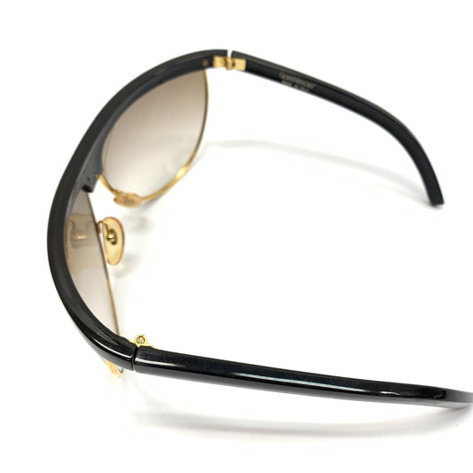 Sunglasses with gold accents on arms