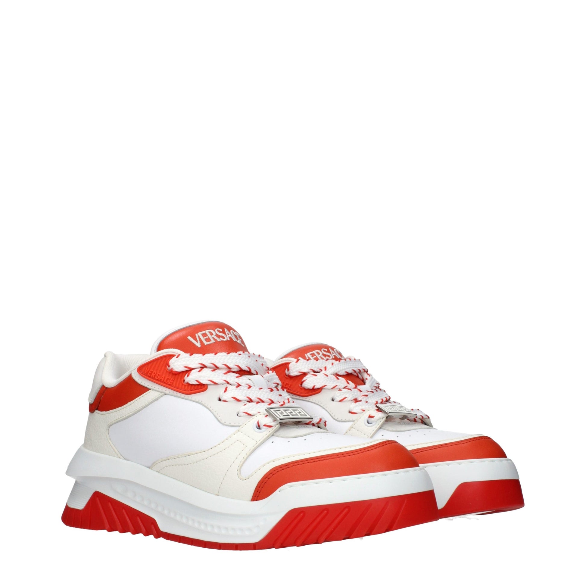 Red and white athletic sneakers with laces