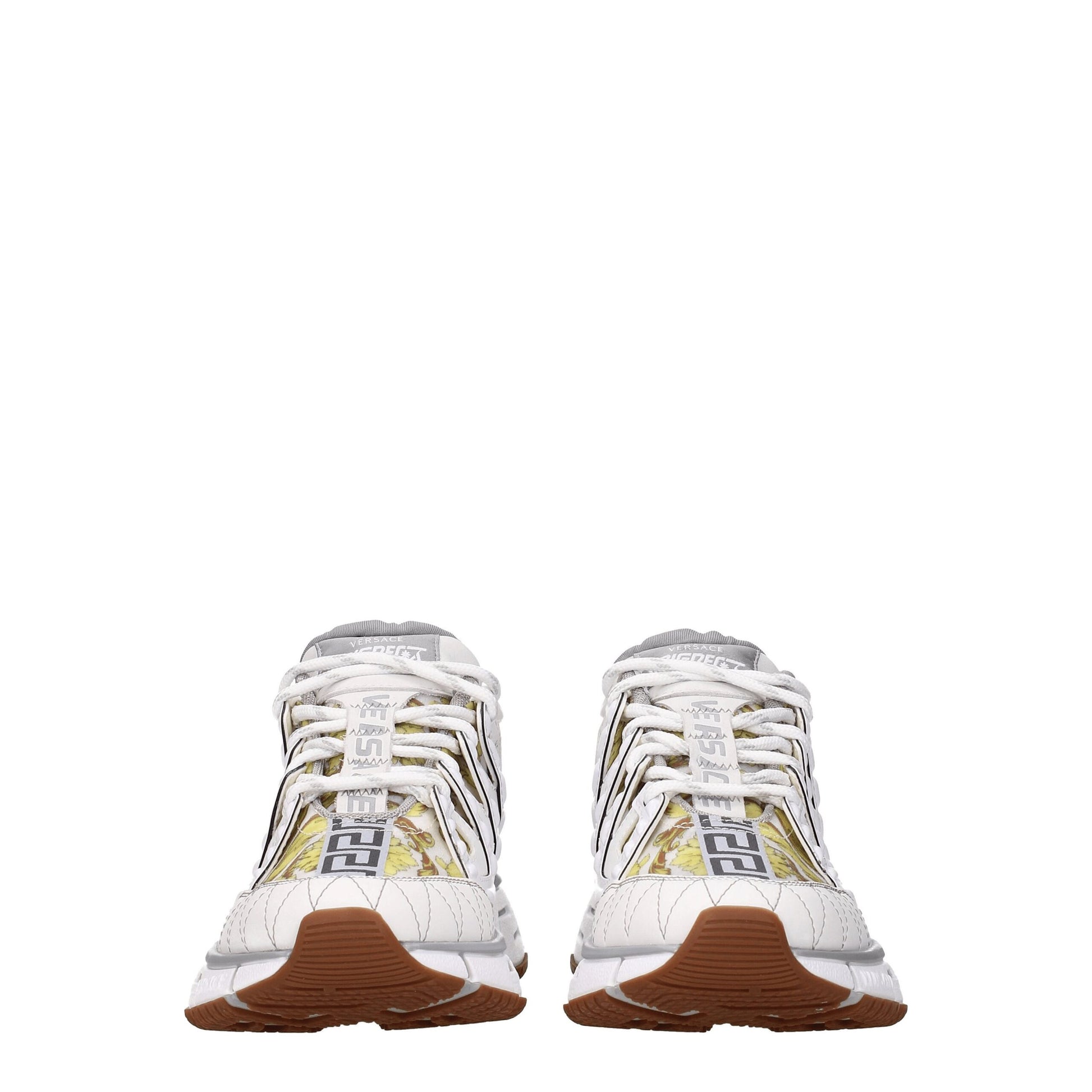 Pair of white leather athletic sneakers with gold accents, featuring a low-top design and lace closure