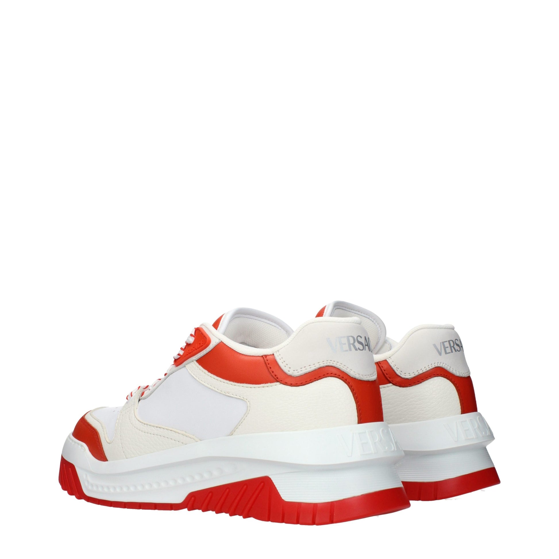 Pair of white leather athletic sneakers with red accents, featuring a low-top design and lace closure