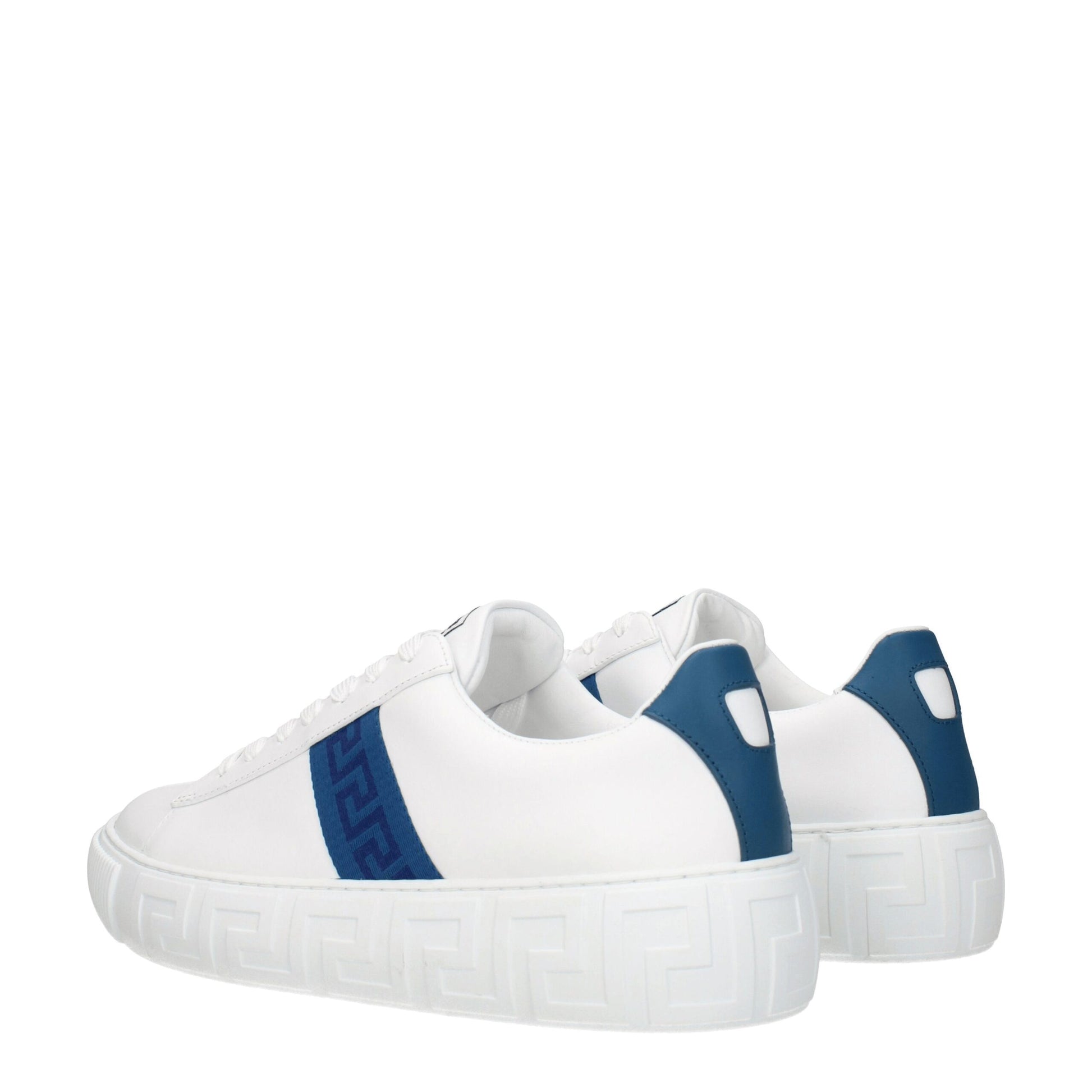Pair of white leather sneakers with blue accents, featuring a low top design and gold buckle closure