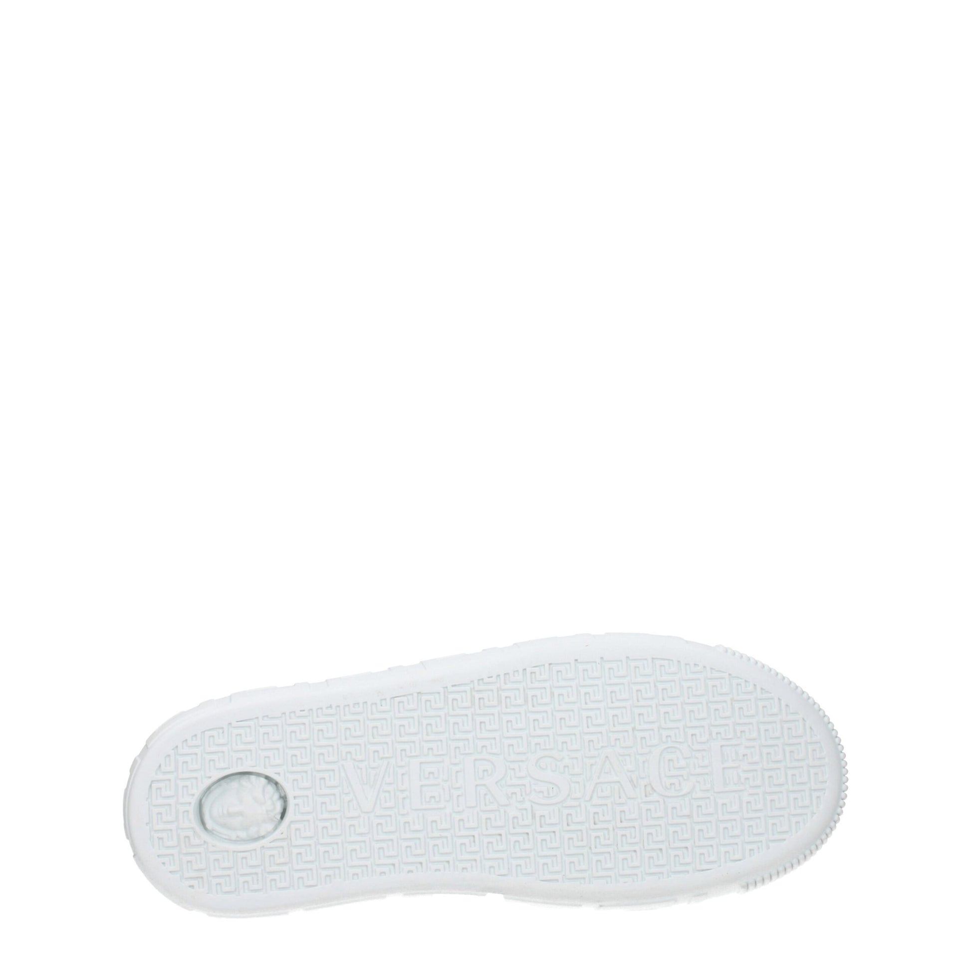 A single white leather sneaker with a low top, featuring a distinctive design on the side and a circular logo on the heel