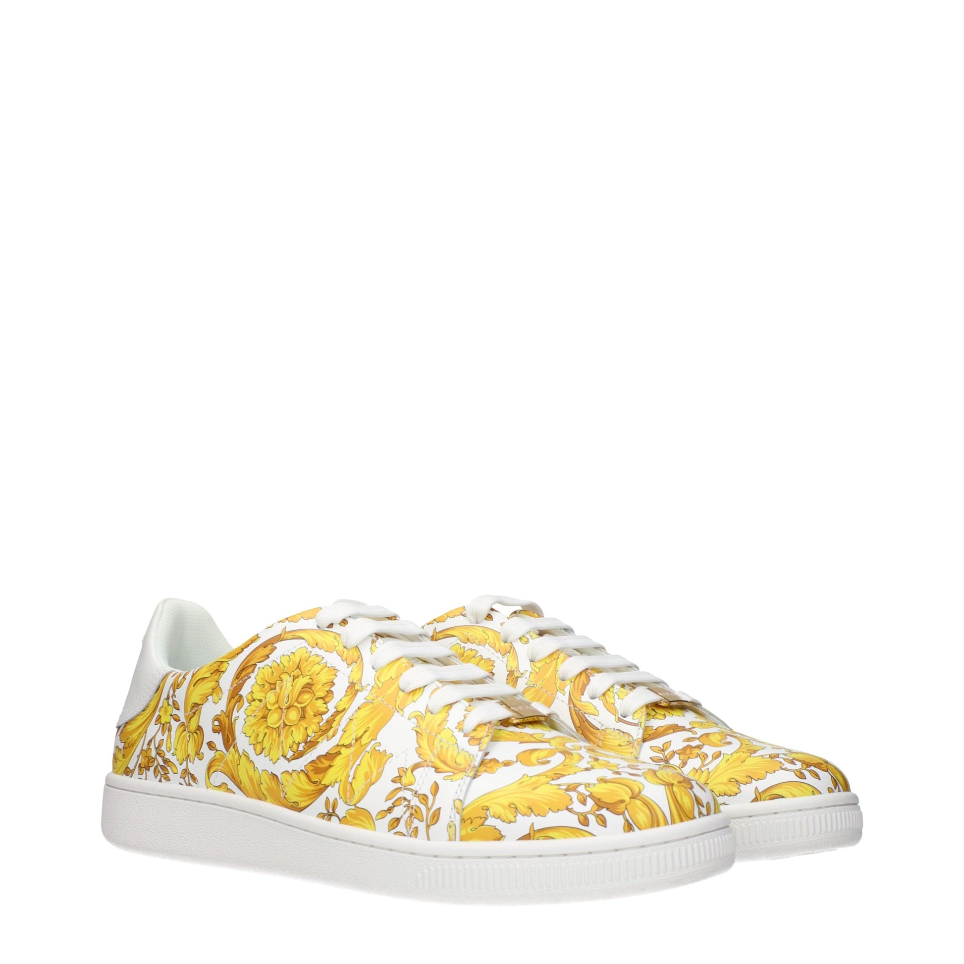 Yellow floral patterned sneakers with white laces and soles
