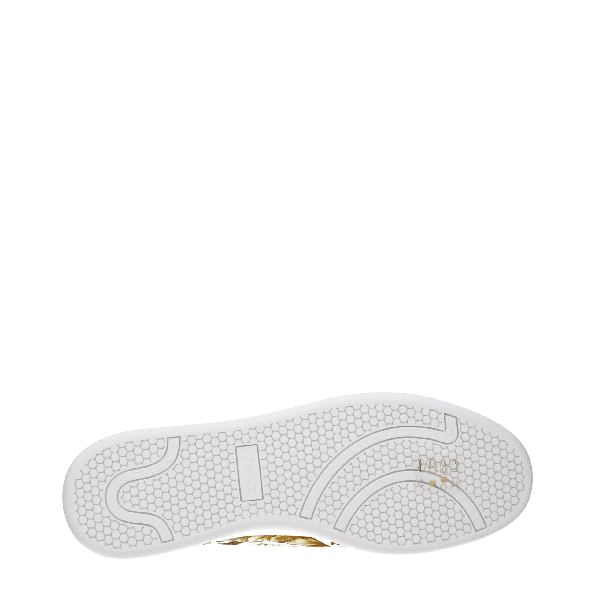 White leather sneaker with gold accents