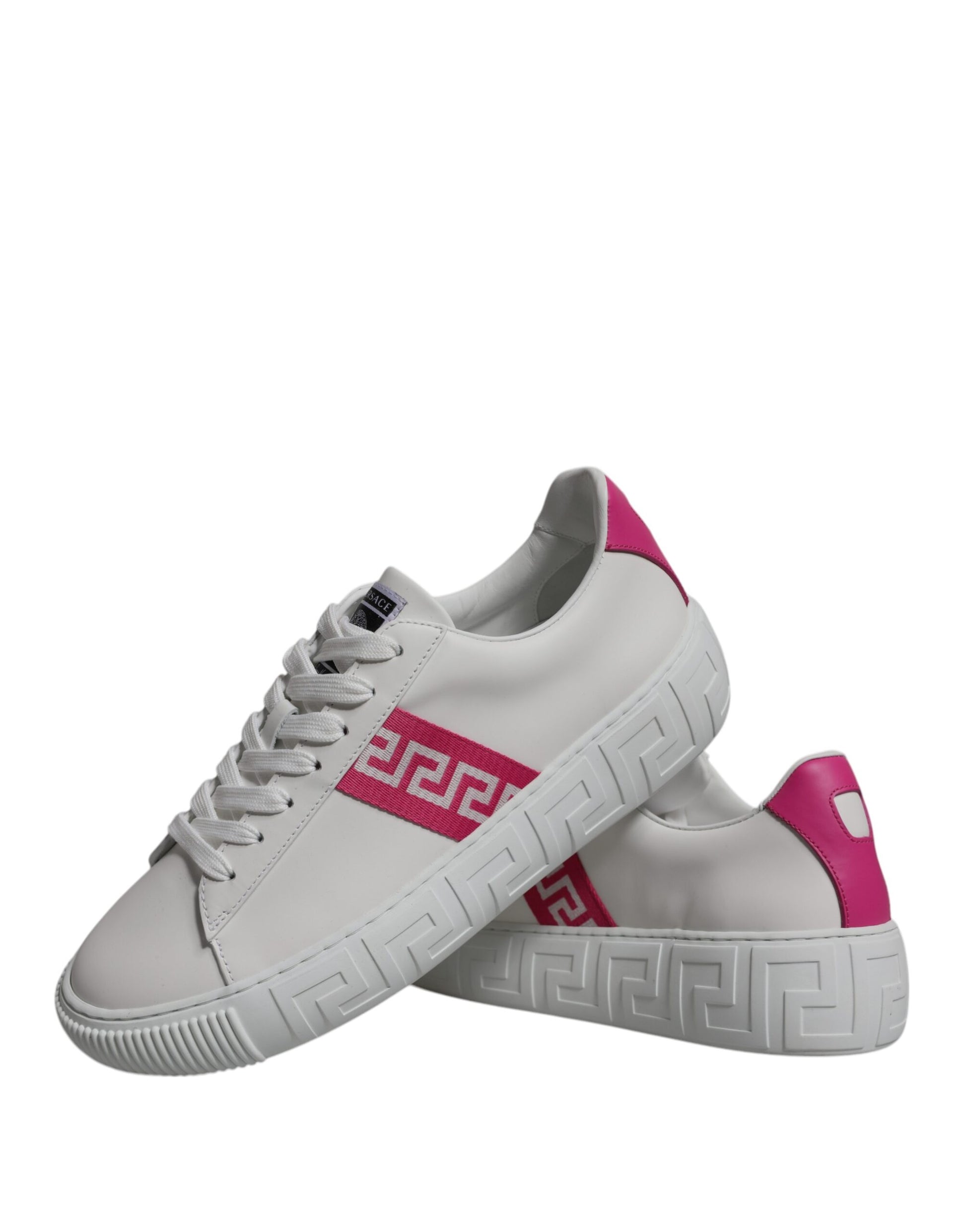 Pair of white sneakers with pink accents and a red logo on the side