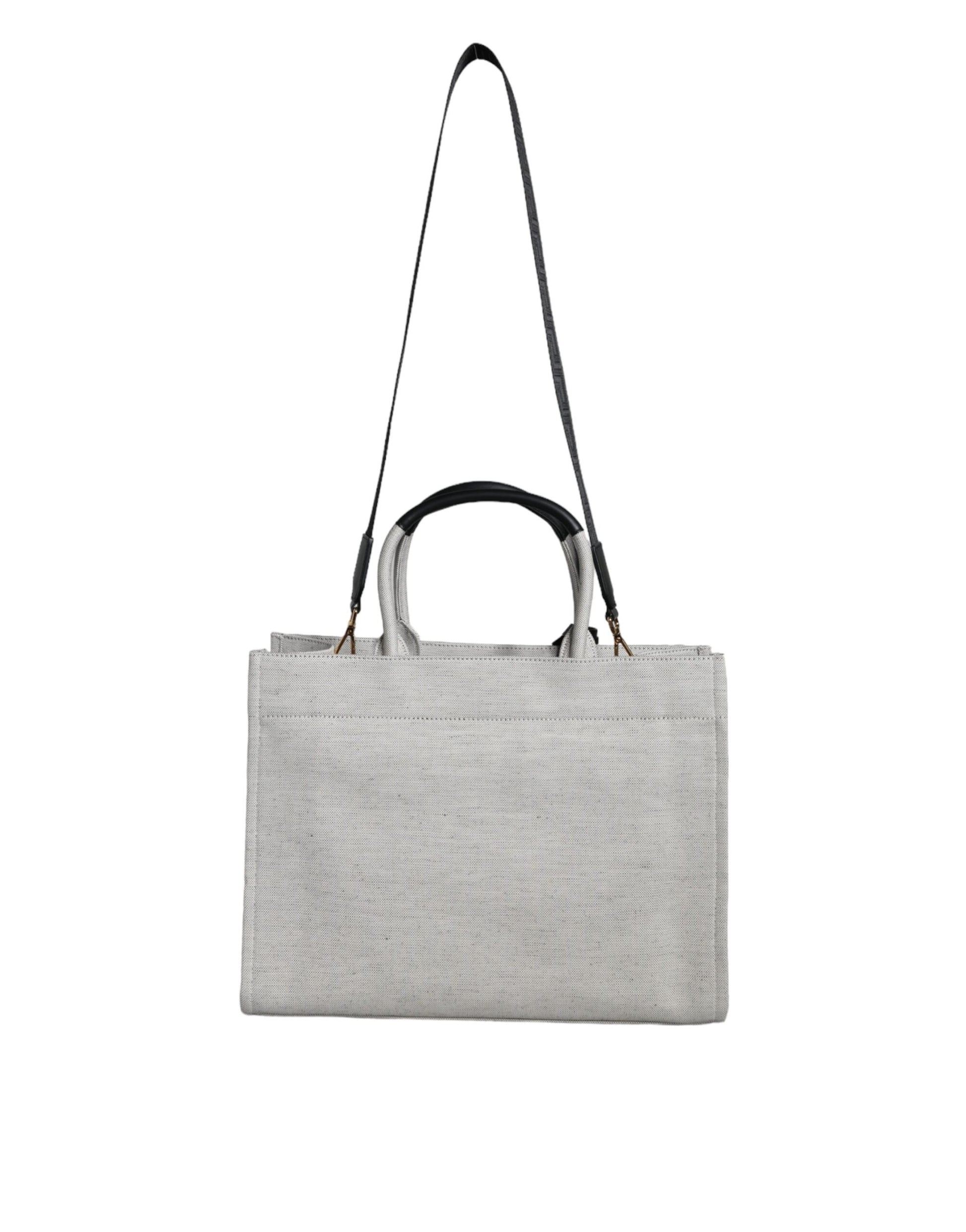Grey tote bag with handles and a strap