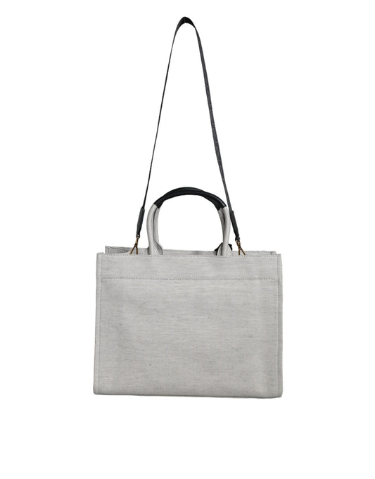 Grey tote bag with handles and a strap