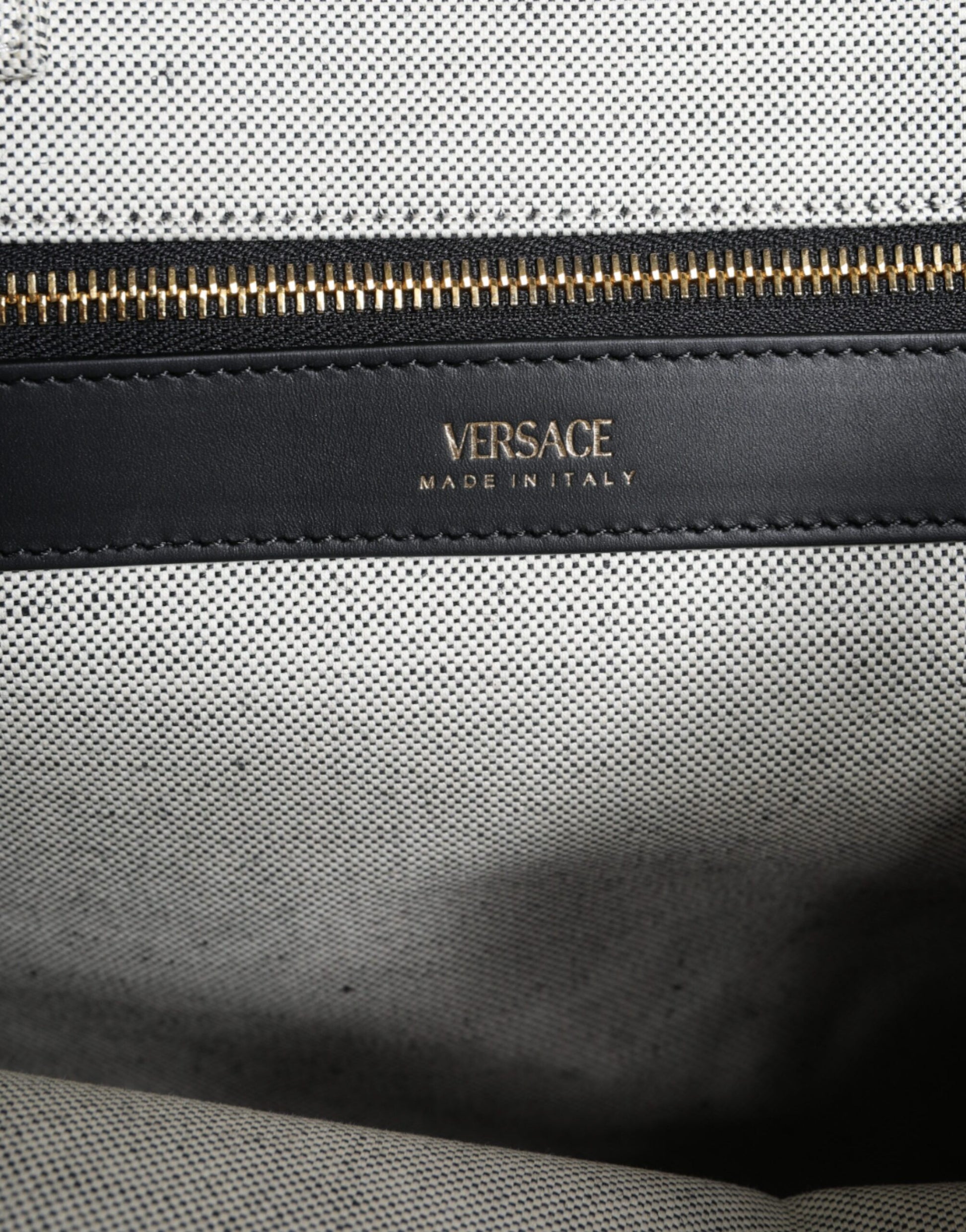Zippered leather wallet with gold accents
