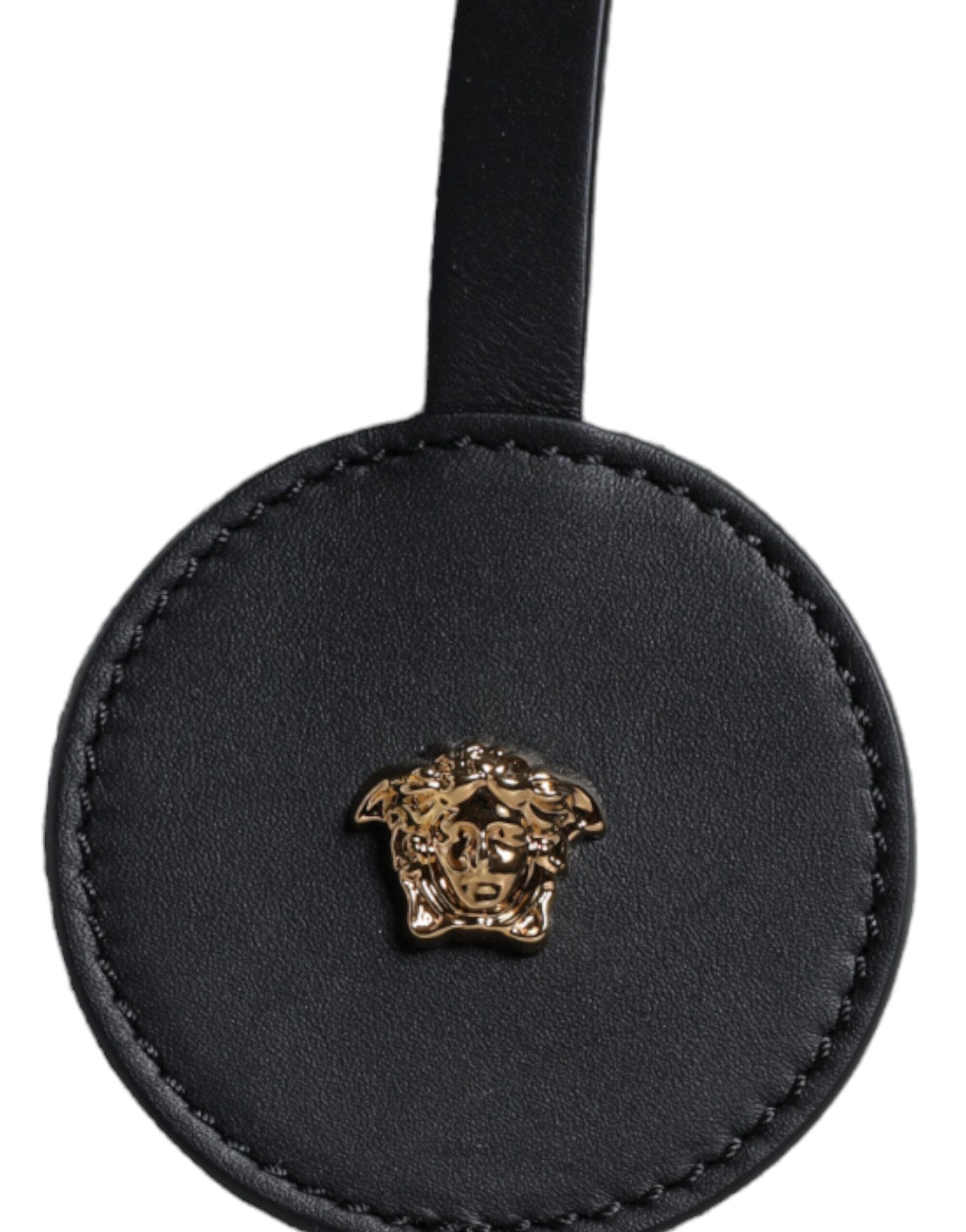 Black leather belt with gold buckle featuring a dog's head