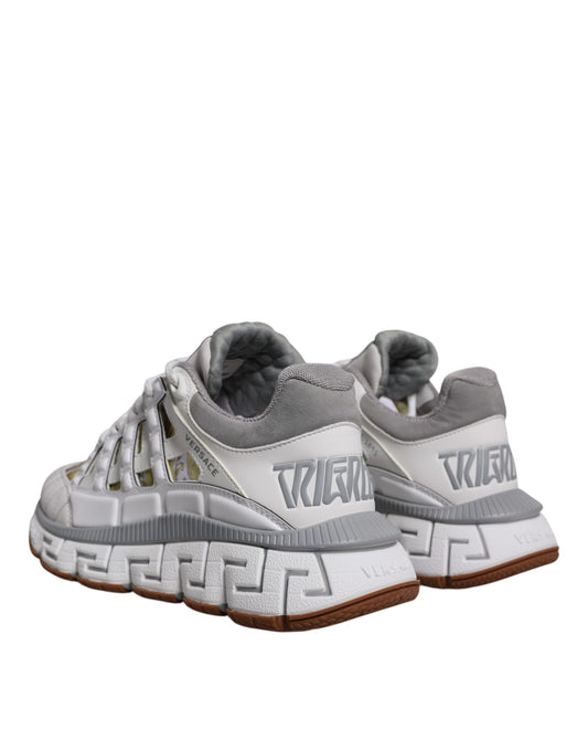Pair of gray and white sneakers with black laces