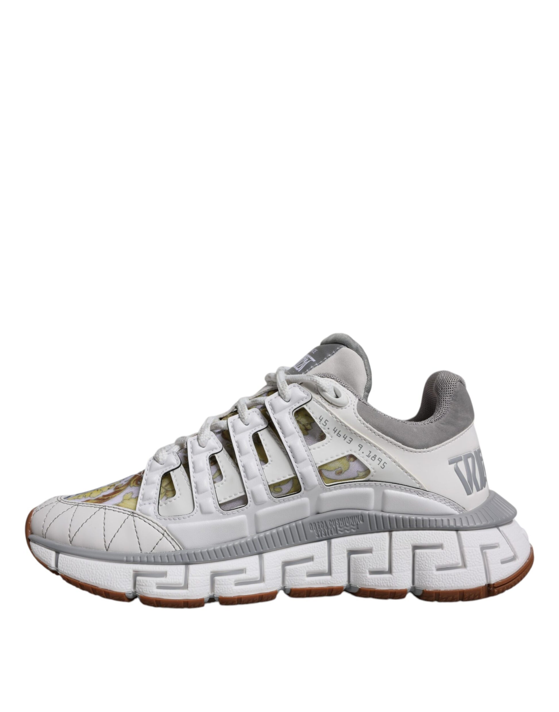 White sneaker with gold accents and a winged logo on the side