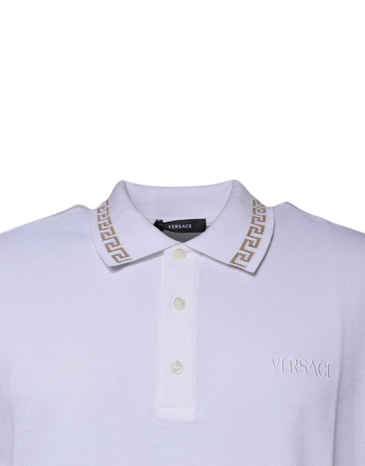The shirt is white with a collar and buttons