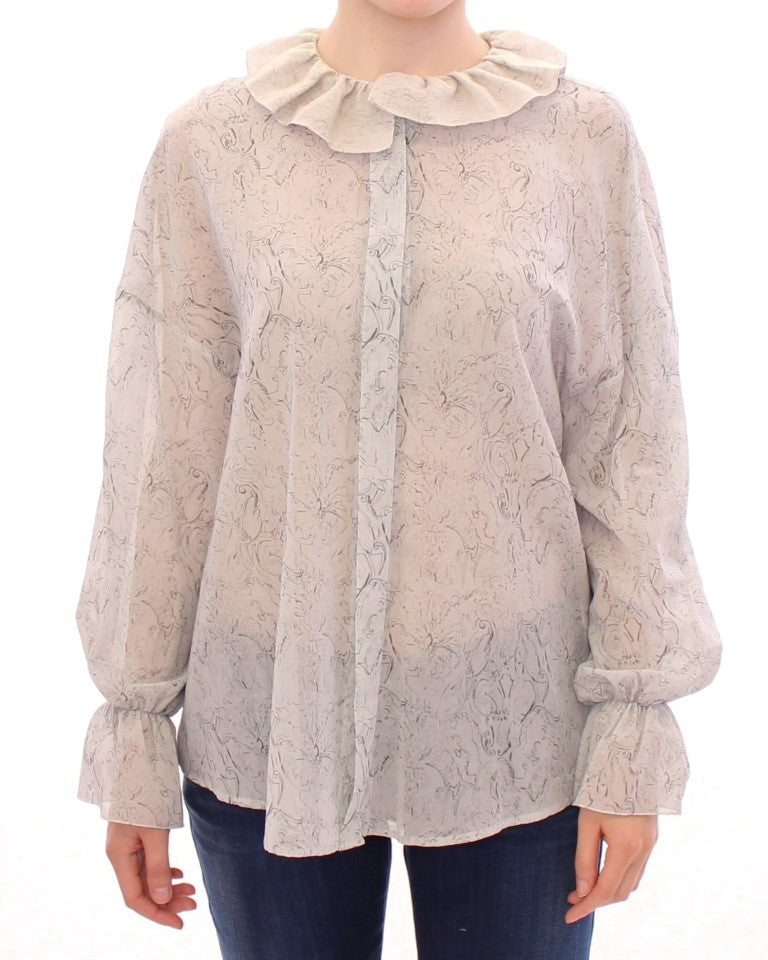 Long sleeve blouse with ruffled collar and cuffs