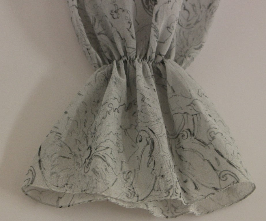A garment with a floral pattern on a white background