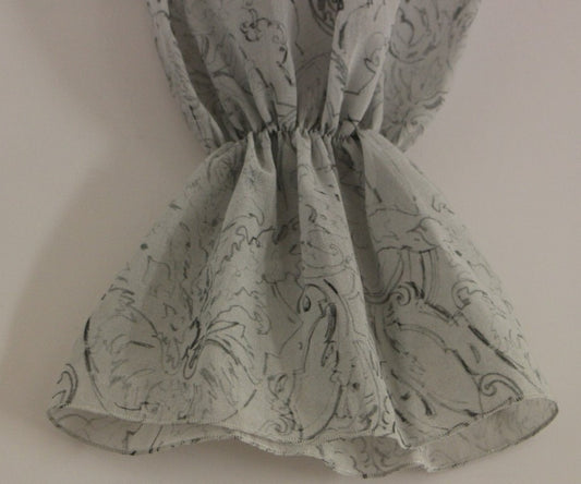 A garment with a floral pattern on a white background