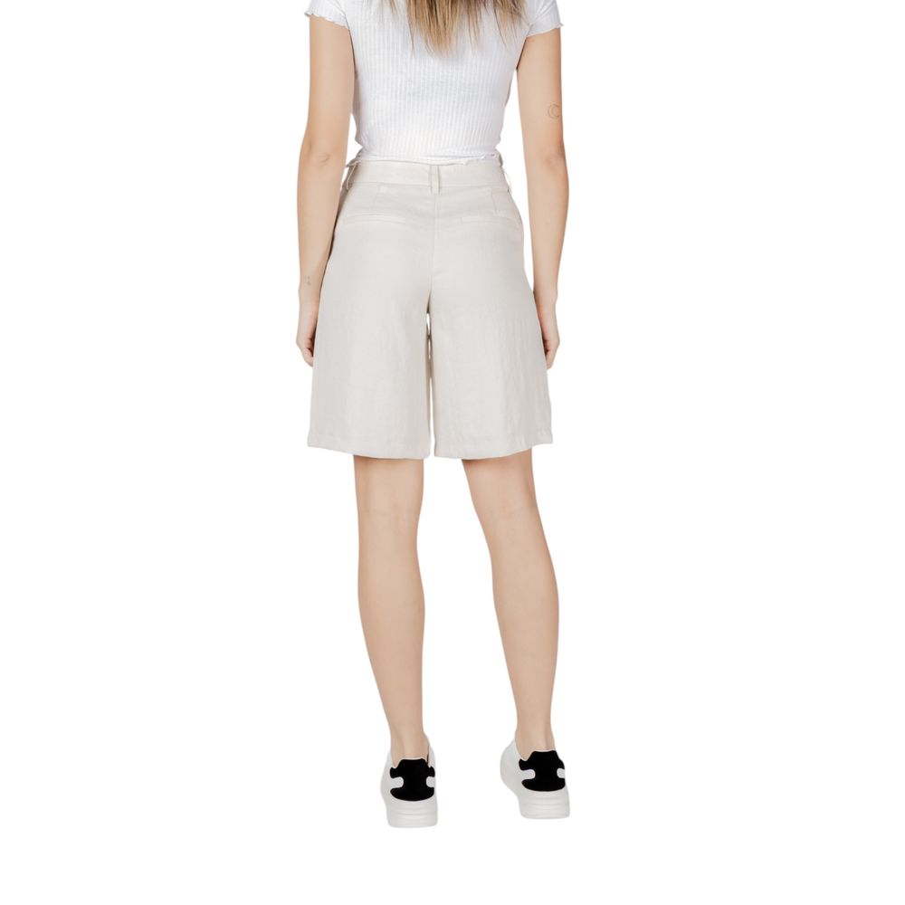 A pair of beige viscose bermuda shorts