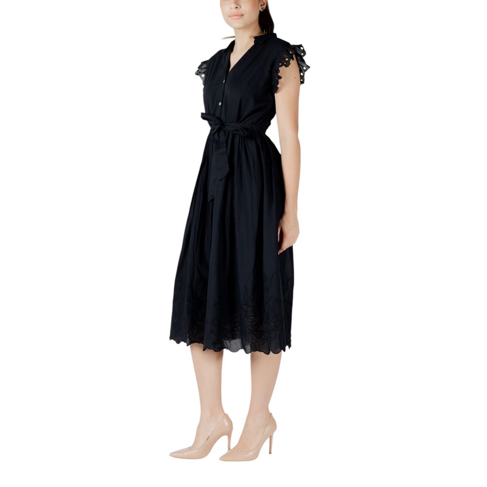 A black midi dress with lace detailing on the bodice