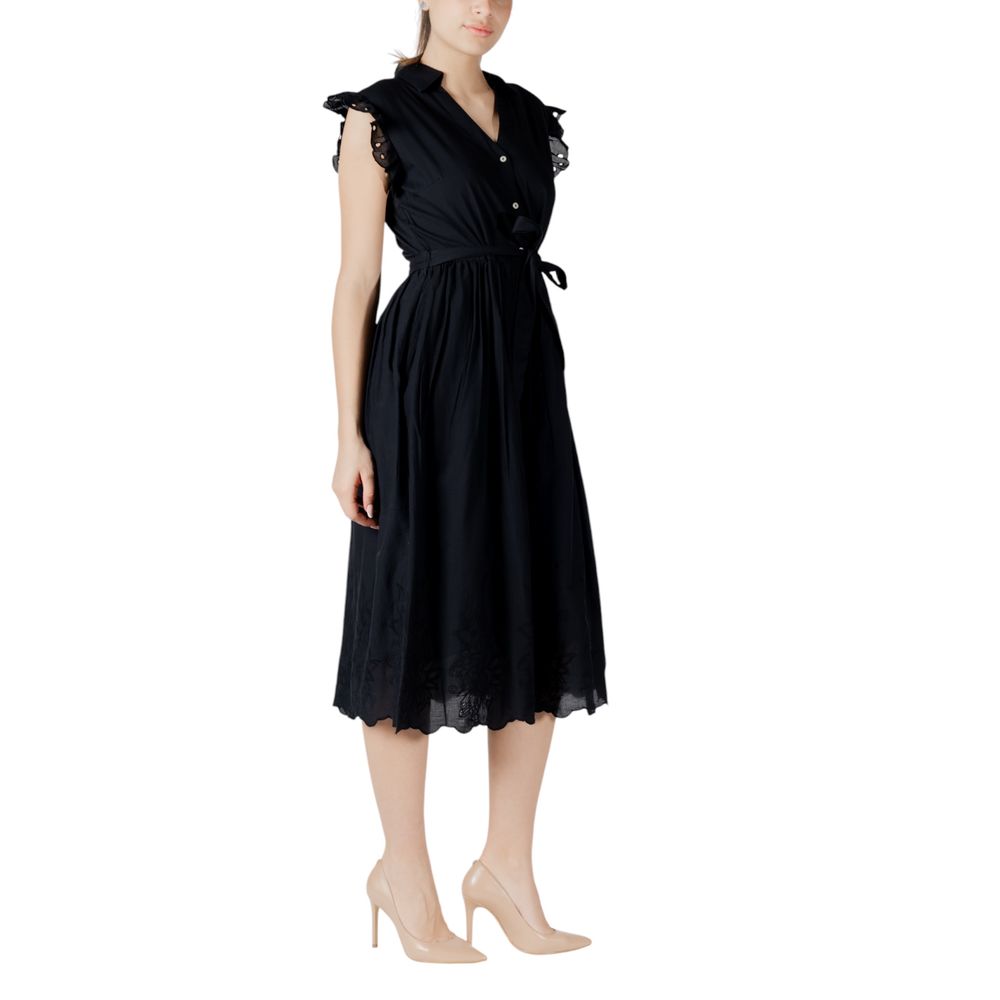 A black midi dress with lace detailing on the bodice