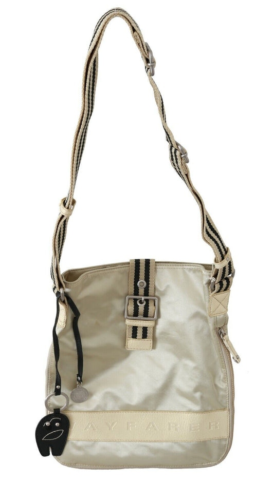 Tan purse with black straps and gold accents