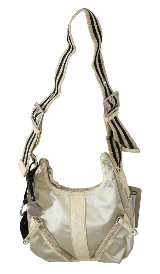 Tan crossbody bag with black straps and a zippered pocket on front