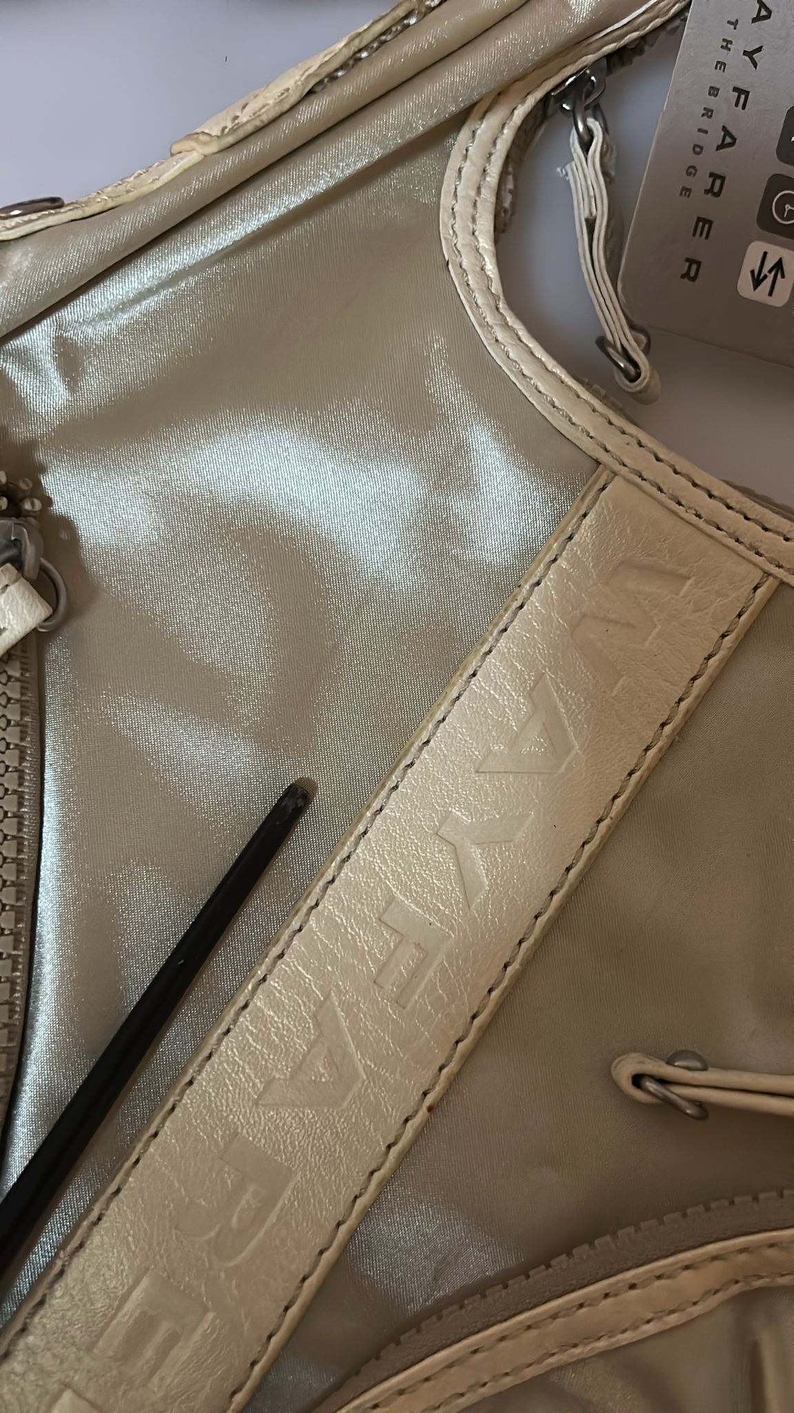 Gold metallic purse with leather trim