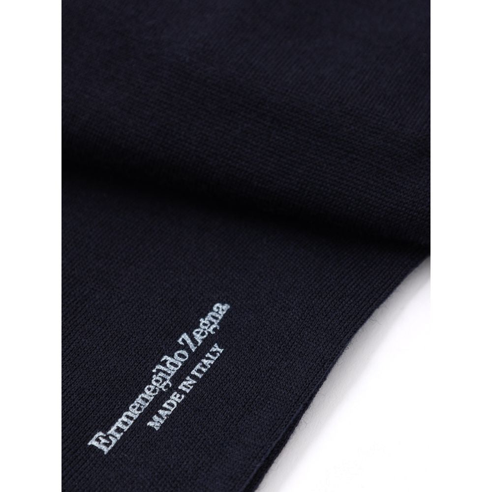 Blue knit sweater with white logo on front