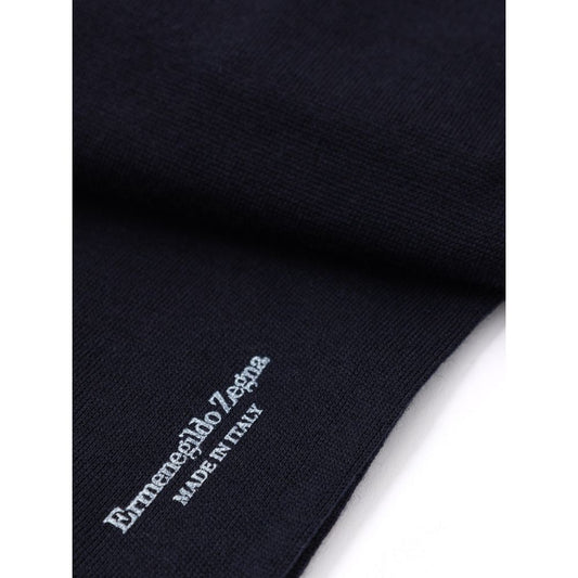 Blue knit sweater with white logo on front