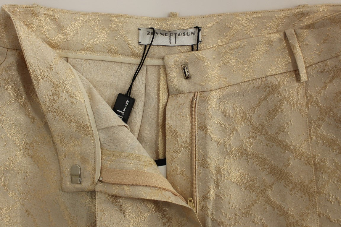 Gold embroidered pants on a mannequin
