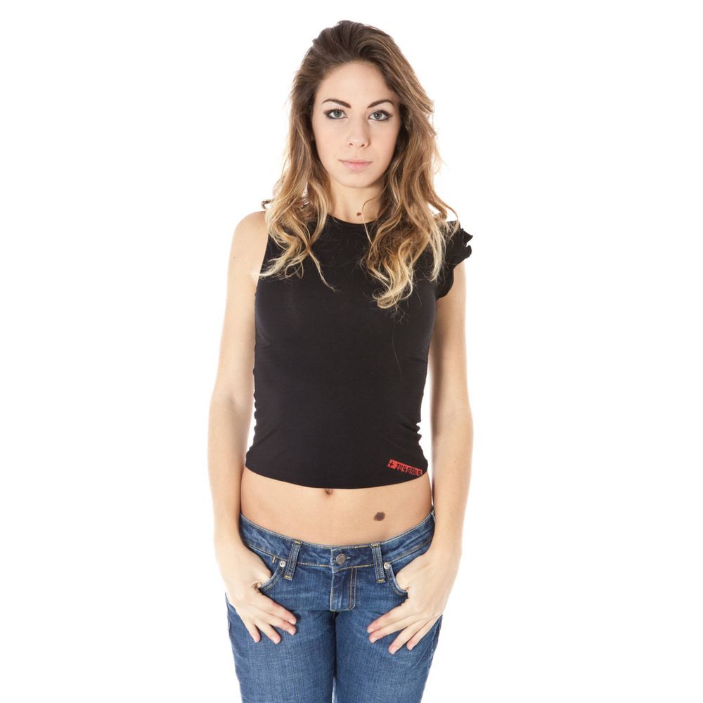 Woman wearing black crop top and blue jeans