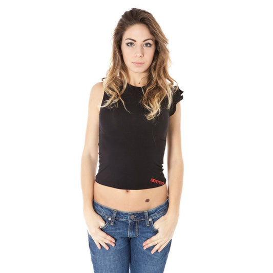 Woman wearing black crop top and blue jeans